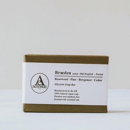 Soap in an olive green textured box with white belly band