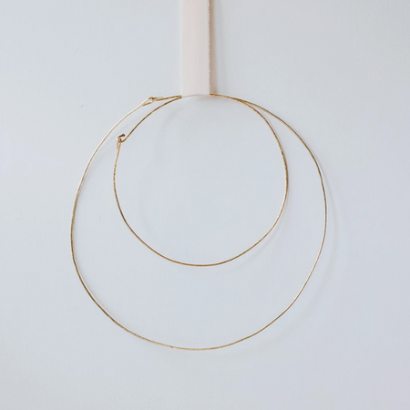 Two hand-hammered brass hoop rings