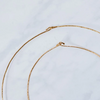 Close up of Aerende brass hoops with loop closure