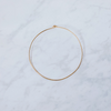 A simple brass hoop on a marble background
